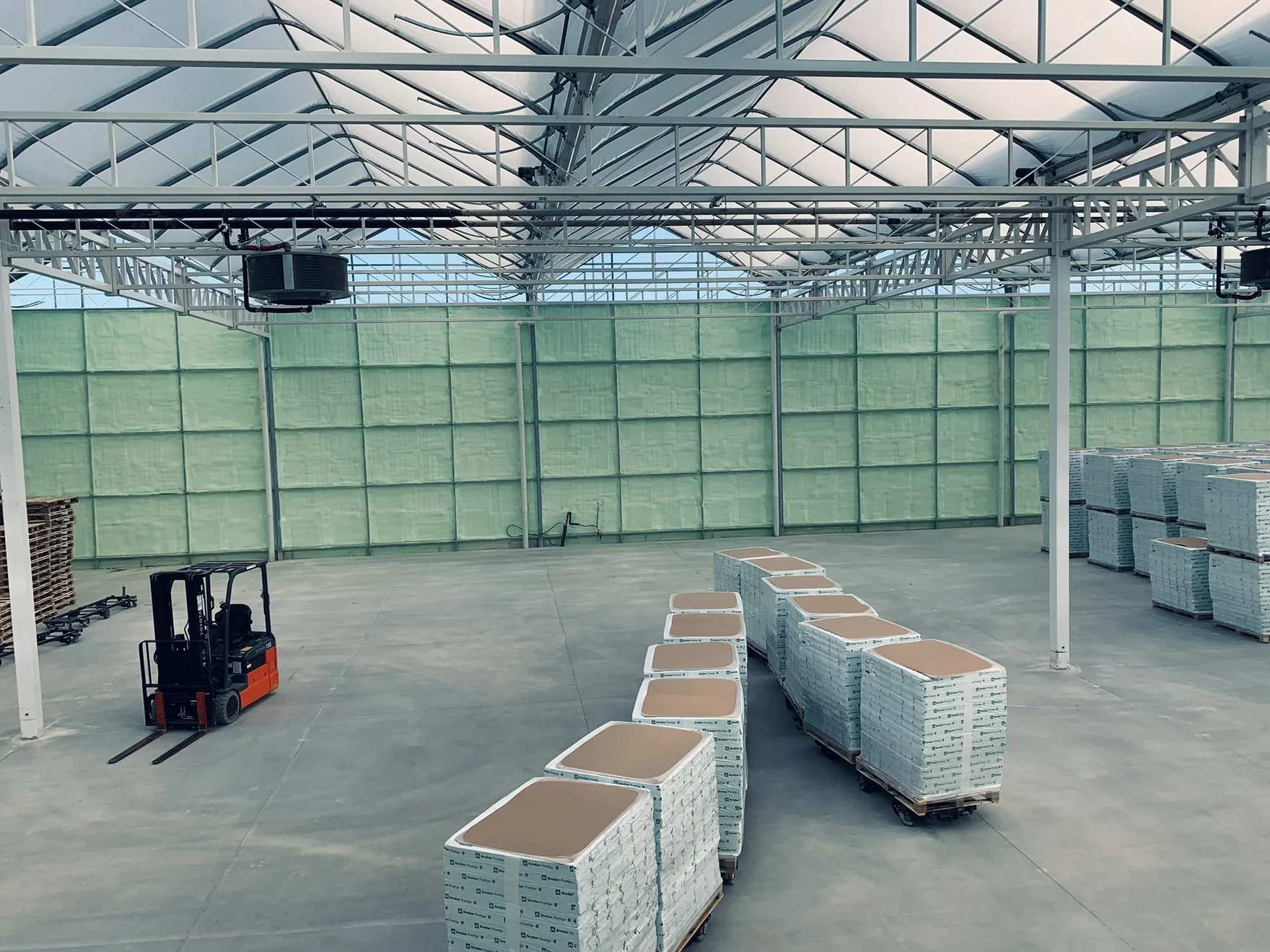 Large commercial facility interior insulated with closed-cell spray foam