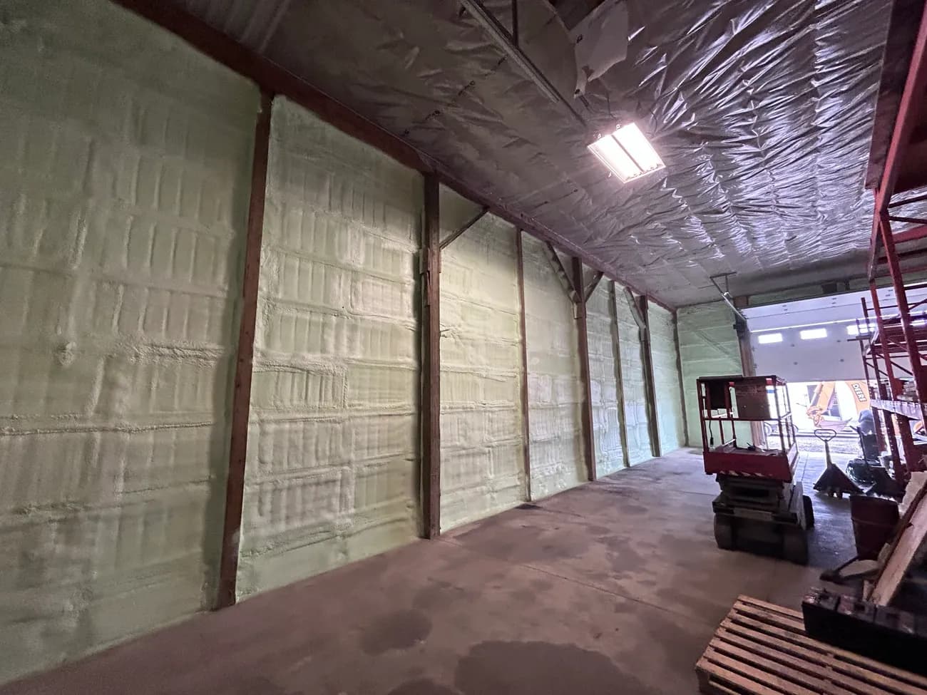 Crawl space walls sealed and insulated with closed-cell spray foam