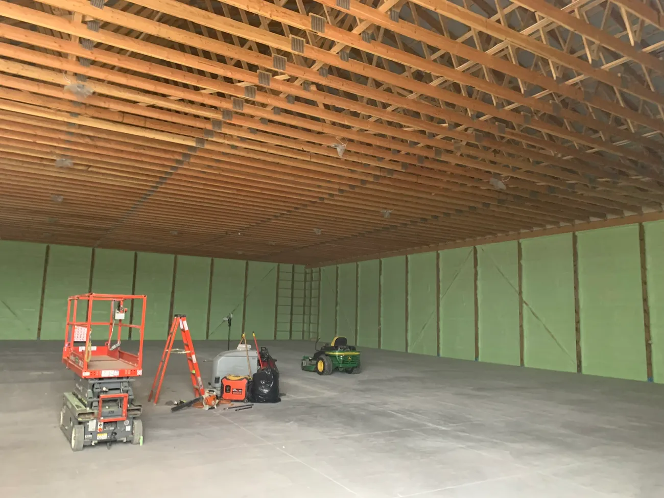 Livestock barn interior insulated with closed-cell spray foam